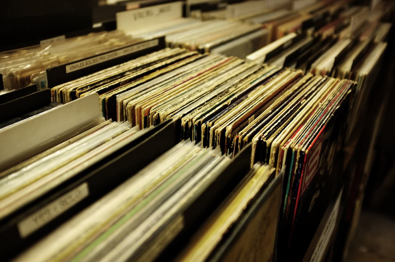 Crates of vinyl records at a store — the house labels worth digging for