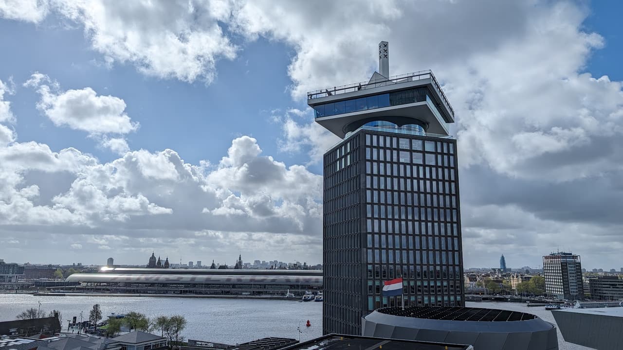 The A'DAM Tower and the Amsterdam skyline across the IJ — Shelter club sits beneath it